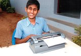 Differently abled student learning by Braille